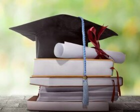 Picture of a grad cap on top of books